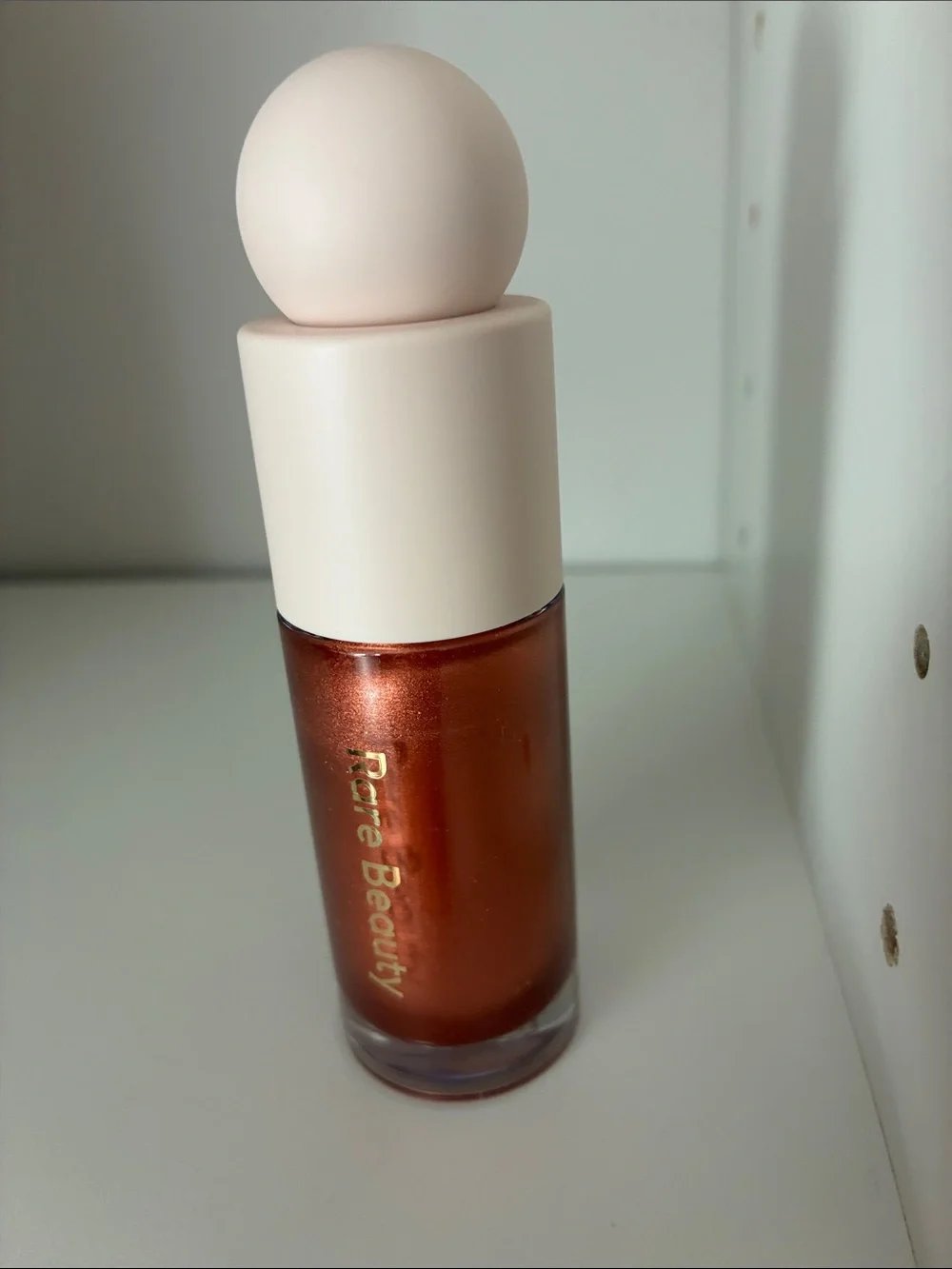 Rare Beauty Positive Light Liquid Luminizer Captivate - Copper Shimmer